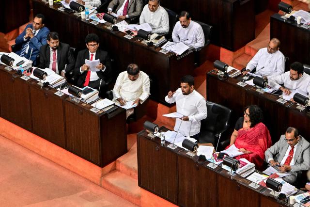 Sri Lanka's President Anura Kumara Dissanayake (C) presents the 2026 budget to parliament in Colombo on November 7, 2025. (Photo by Ishara S. KODIKARA / AFP)
