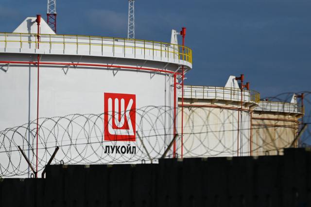 (FILES) This photograph taken on March 17, 2022, shows Lukoil fuel storage tanks at Rosenets Port terminal near the city of Burgas at the Black sea coast. Bulgaria's parliament adopted on November 7, 2025 legal changes to place Lukoil's refinery in the east of the country under state control following US sanctions against the Russian oil giant. (Photo by Nikolay DOYCHINOV / AFP)