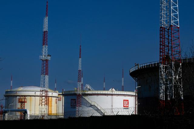 (FILES) This photograph taken on March 17, 2022, shows Lukoil fuel storage tanks at Rosenets Port terminal near the city of Burgas at the Black sea coast. Bulgaria's parliament adopted on November 7, 2025 legal changes to place Lukoil's refinery in the east of the country under state control following US sanctions against the Russian oil giant. (Photo by Nikolay DOYCHINOV / AFP)
