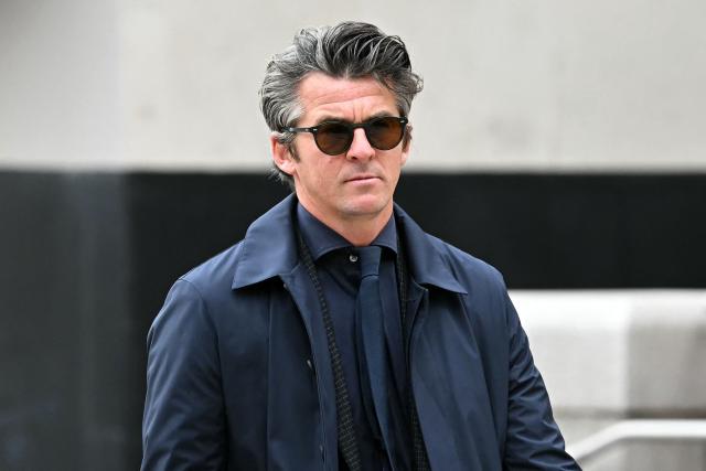 (FILES) Former footballer Joey Barton arrives at Liverpool Crown Court on August 27, 2024, accused of an offence of malicious communications relating to tweets he made in January this year. Former Manchester City footballer Joey Barton has been convicted of sending grossly offensive social media posts about leading British broadcaster Jeremy Vine and female television soccer pundits Lucy Ward and Eni Aluko. (Photo by Paul ELLIS / AFP)