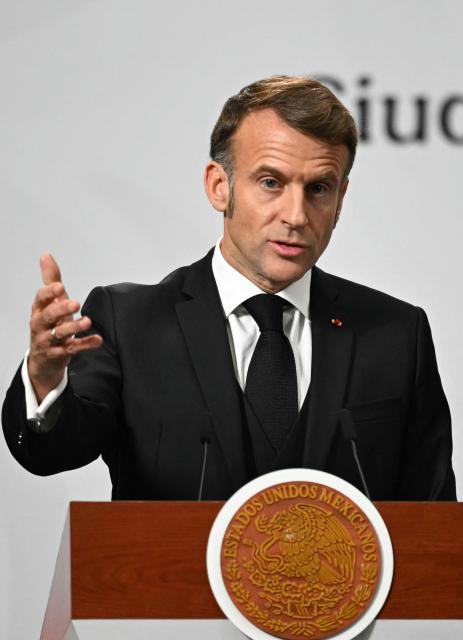 France's President Emmanuel Macron speaks next to Mexico's President Claudia Sheinbaum (out of frame) during a joint press conference at the National Palace in Mexico City on November 7, 2025. (Photo by CARL DE SOUZA / AFP)