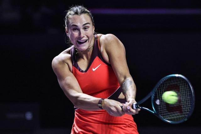 Belarus' Aryna Sabalenka hits a return against USA’s Amanda Anisimova during their semi-final tennis match at the WTA Finals in Riyadh on November 7, 2025. (Photo by Fayez NURELDINE / AFP)