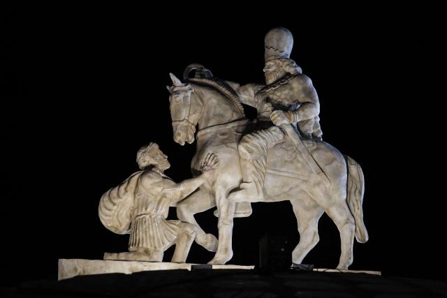 A photograph shows a statue depicting Sasanian king Shapur I capturing Roman emperor Valerian during its unveiling at Enghelab (Revolution) Square in the capital Tehran on November 7, 2025. The event was the latest in a series of unveiling national symbols following Iran's recent 12-day war with Israel in June. The statue was modelled on an original stone engraving in southern Iran, symbolising Iranian triumph over foreign foes. (Photo by AFP)