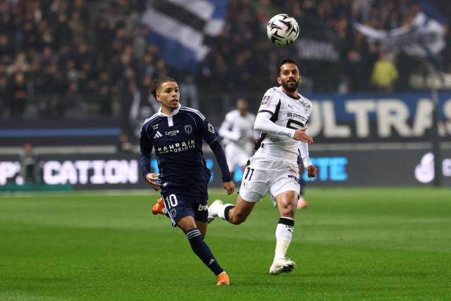 Paris FC's French midfielder #10 Ilan Kebbal (L) and Rennes' Jordanian forward #11 Mousa Tamari (R) fight for the ball during the French L1 football match between Paris FC and Stade Rennais FC at the Jean-Bouin stadium in Paris, on November 7, 2025. (Photo by FRANCK FIFE / AFP)