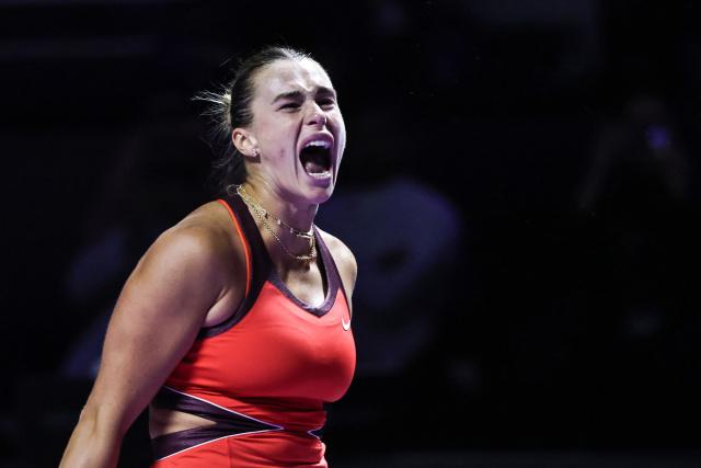 Belarus' Aryna Sabalenka reacts after playing a point against USA’s Amanda Anisimova during their semi-final tennis match at the WTA Finals in Riyadh on November 7, 2025. (Photo by Fayez NURELDINE / AFP)
