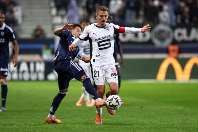 Paris FC's French midfielder #21 Maxime Lopez (CL) tackles Rennes' French midfielder #21 Valentin Rongier (CR) during the French L1 football match between Paris FC and Stade Rennais FC at the Jean-Bouin stadium in Paris, on November 7, 2025. (Photo by FRANCK FIFE / AFP)