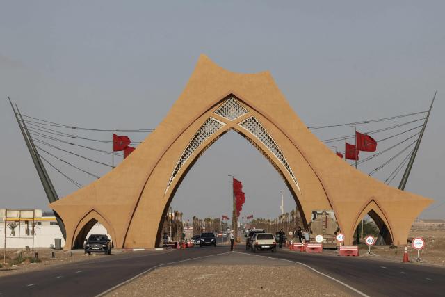 A photograph shows a monumental gate, inspired by the traditional Sahrawi tent, at the entrance to Laayoune, the main city of Moroccan-controlled Western Sahara, on November 6, 2025. The UN Security Council voted on October 31, 2025 in favor of a resolution backing Morocco's autonomy plan for Western Sahara as the "most feasible" solution for the disputed territory, triggering celebrations in Rabat but angering Algeria. (Photo by Abdel Majid BZIOUAT / AFP)