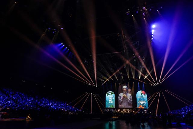 TOPSHOT - Believers attend the Congres Mission 2025 meeting at the Accor Arena Paris theatre in Paris, on November 7, 2025. (Photo by STEPHANE DE SAKUTIN / AFP)