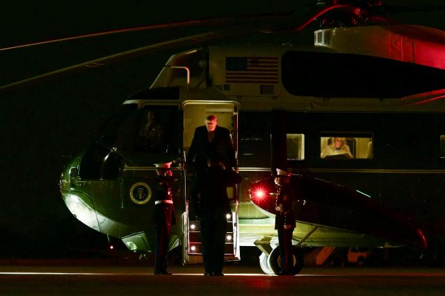 US President Donald Trump steps off Marine One to board Air Force One at Joint Base Andrews, Maryland, on November 7, 2025 as he travels to Florida for the weekend. (Photo by Jim WATSON / AFP)