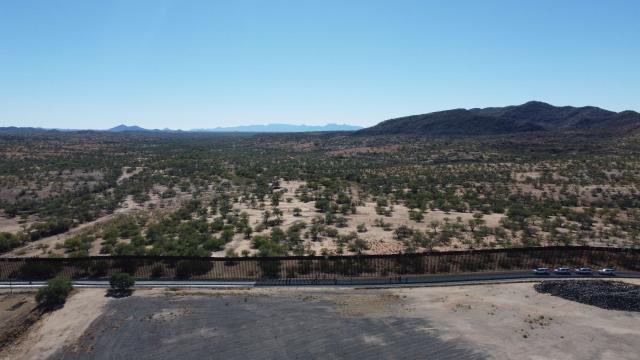 Aerial view of the border wall built by the Donald Trump administration to reduce irregular migration in the Sasabe area, Arizona, on November 7, 2025. (Photo by HERIKA MARTINEZ / AFP)