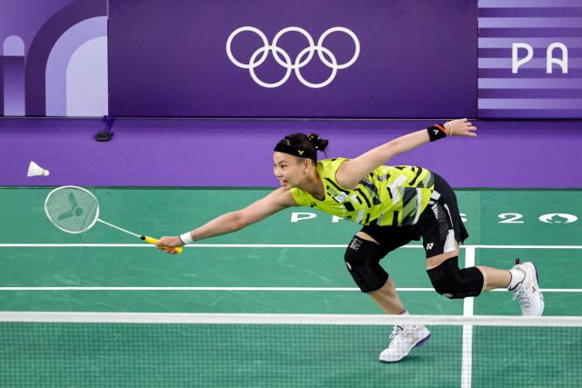 (FILES) Taiwan's Tai Tzu-ying plays a shot to Belgium's Lianne Tan in the women's singles badminton group stage match during the Paris 2024 Olympic Games at Porte de la Chapelle in Paris on July 28, 2024. Taiwan's badminton star and Olympic silver medallist Tai Tzu-ying has announced her retirement on November 8, 2025, saying her era "has come to an end" but that she hopes her spirit stays with fans. (Photo by David GRAY / AFP)