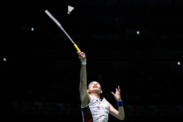 (FILES) Taiwan's Tai Tzu-ying hits a return against Japan's Natsuki Nidaira during their women's singles quarter final on day four of the Japan Open badminton tournament at Yokohama Arena in Yokohama, Kanagawa prefecture, south of Tokyo on August 23, 2024. Taiwan's badminton star and Olympic silver medallist Tai Tzu-ying has announced her retirement on November 8, 2025, saying her era "has come to an end" but that she hopes her spirit stays with fans. (Photo by Yuichi YAMAZAKI / AFP)
