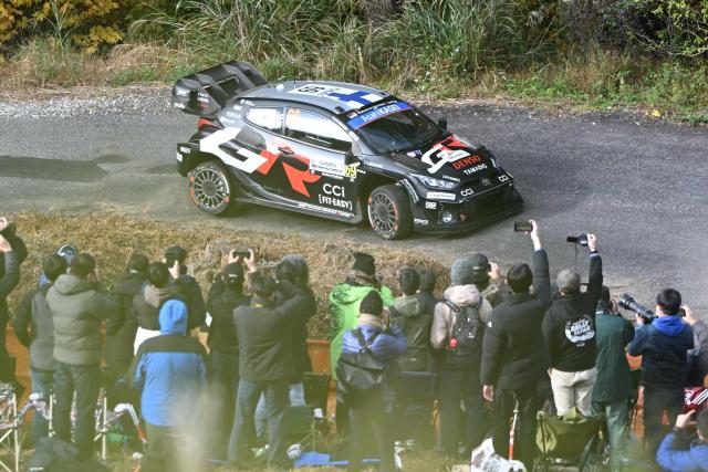 Kalle Rovanpera and his co-driver Jonne Halttiunen of Finland drive their Toyota GR Yaris Rally1 during the SS9 Ena section of the Rally Japan, the 13th round of FIA World Rally Championships, in Ena city, Gifu prefecture on November 8, 2025. (Photo by Toshifumi KITAMURA / AFP)