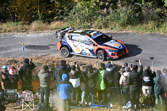 Ott Tanak and his co-driver Martin Jarveoja of Estonia drive their Hyundai i20 N Rally1 during the SS9 Ena section of the Rally Japan, the 13th round of FIA World Rally Championships, in Ena city, Gifu prefecture on November 8, 2025. (Photo by Toshifumi KITAMURA / AFP)