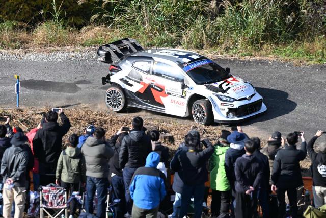 Sami Pajari and his co-driver Marko Salminen of of Finland drive their Toyota GR Yaris Rally1 during the SS9 Ena section of the Rally Japan, the 13th round of FIA World Rally Championships, in Ena city, Gifu prefecture on November 8, 2025. (Photo by Toshifumi KITAMURA / AFP)