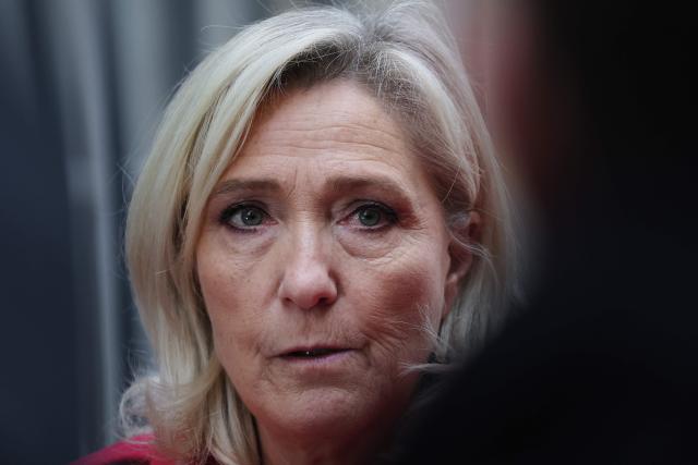 (FILES) President of Rassemblement National parliamentary group Marine Le Pen speaks to the media after a meeting with French Prime Minister Sebastien Lecornu at the Hotel Matignon in Paris, on October 3, 2025, during a round of consultations with political parties ahead of the announcement of the new government. President of Rassemblement National parliamentary group Marine Le Pen's trial for insulting a veiled student designated "Young European of the Year" 2019 will be held at the Paris Judicial Court on November 10, 2025. (Photo by Anne-Christine POUJOULAT / AFP)