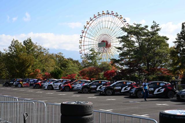Rally cars are line up at the Enakyo park for Regroup during the Rally Japan, the 13th round of the FIA World Rally Championships in Nakatsugawa city, Gifu prefecture on November 8, 2025. (Photo by Toshifumi KITAMURA / AFP)
