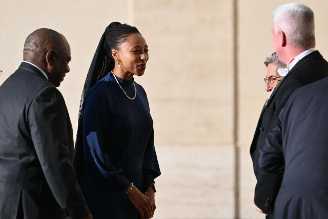 South Africa's President Cyril Ramaphosa (L) and her daughter Keneilwe Ramaphosa (2nd L) arrive at St Damaso courtyard to meet with Pope Leo XIV in Vatican City on November 8, 2025. (Photo by Alberto PIZZOLI / AFP)