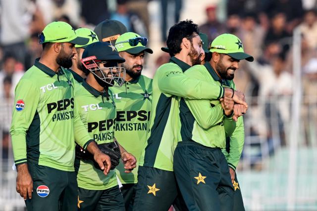 Pakistan's players celebrate after the dismissal of South Africa's Tony de Zorzi during the third and final one-day international (ODI) cricket match between Pakistan and South Africa at the Iqbal Stadium in Faisalabad on November 8, 2025. (Photo by Aamir QURESHI / AFP)