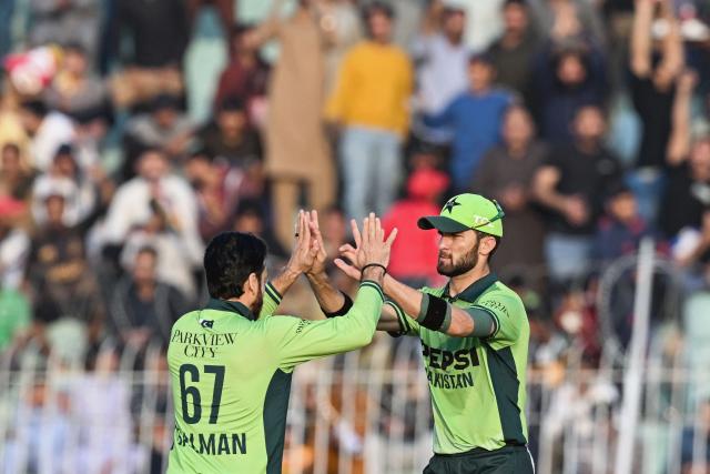 Pakistan's Salman Agha (L) celebrates with captain Shaheen Shah Afridi after taking the wicket of South Africa's Tony de Zorzi during the third and final one-day international (ODI) cricket match between Pakistan and South Africa at the Iqbal Stadium in Faisalabad on November 8, 2025. (Photo by Aamir QURESHI / AFP)