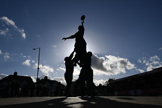 The bronze statue of a rugby line-out by British sculptor Gerald Laing is pictured outside the stadium ahead of the Autumn Nations Series international rugby union match between England and Fiji at Allianz Stadium, Twickenham, in south-west London, on November 8, 2025. (Photo by Glyn KIRK / AFP)
