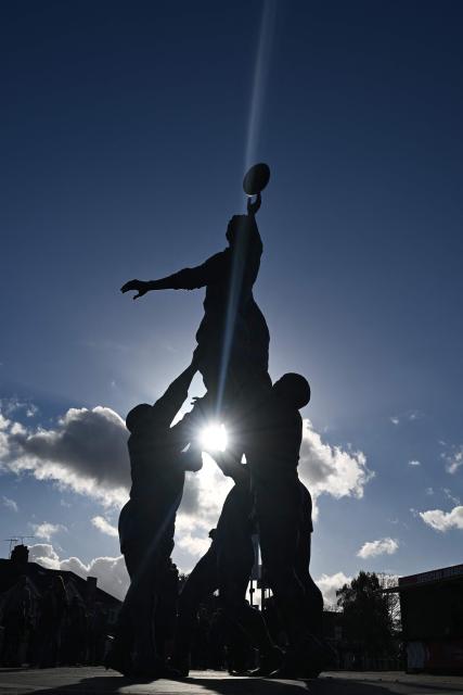 The bronze statue of a rugby line-out by British sculptor Gerald Laing is pictured outside the stadium ahead of the Autumn Nations Series international rugby union match between England and Fiji at Allianz Stadium, Twickenham, in south-west London, on November 8, 2025. (Photo by Glyn KIRK / AFP)