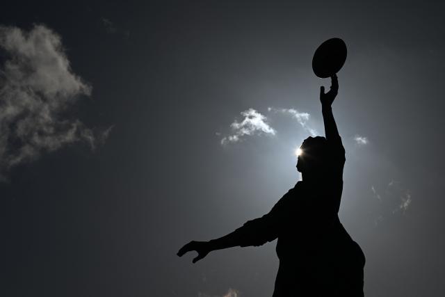 The bronze statue of a rugby line-out by British sculptor Gerald Laing is pictured outside the stadium ahead of the Autumn Nations Series international rugby union match between England and Fiji at Allianz Stadium, Twickenham, in south-west London, on November 8, 2025. (Photo by Glyn KIRK / AFP)