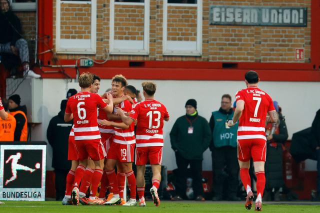 Union Berlin's players celebrate the opening goal by Dutch defender #05 Danilho Doekhi during the German first division Bundesliga football match between 1 FC Union Berlin and FC Bayern Munich in Berlin on November 8, 2025. (Photo by Odd ANDERSEN / AFP) / DFL REGULATIONS PROHIBIT ANY USE OF PHOTOGRAPHS AS IMAGE SEQUENCES AND/OR QUASI-VIDEO