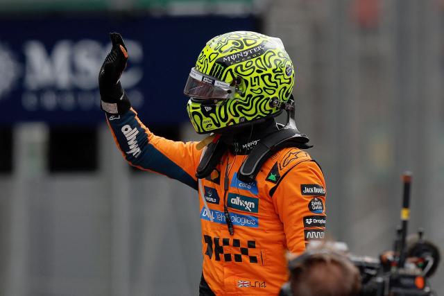 TOPSHOT - McLaren's British driver Lando Norris celebrates after winning the sprint of the Sao Paulo Formula One Grand Prix at the Jose Carlos Pace racetrack, aka Interlagos, in Sao Paulo, Brazil on November 8, 2025. (Photo by Miguel SCHINCARIOL / AFP)