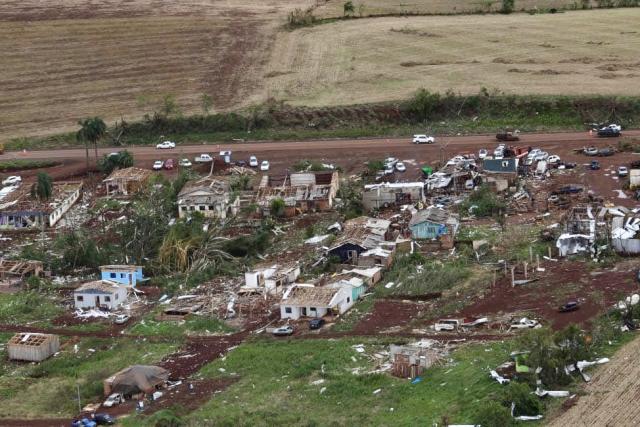 This aerial handout photo released by the Parana State Government shows the destruction after a tornado with winds of up to 250 kilometers per hour hit the city of Rio Bonito do Iguacu, in Brazil's Parana State on November 7, 2025. A tornado killed at least six people and injured more than 430 as it destroyed most of a town in southern Brazil, authorities said Saturday. (Photo by Handout / Parana State Government / AFP)
