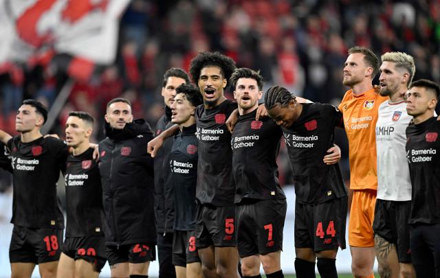 Bayer Leverkusen's players react after the German first division Bundesliga football match between Bayer Leverkusen and 1 FC Heidenheim in Leverkusen, western Germany on November 8, 2025. (Photo by INA FASSBENDER / AFP) / DFL REGULATIONS PROHIBIT ANY USE OF PHOTOGRAPHS AS IMAGE SEQUENCES AND/OR QUASI-VIDEO