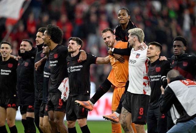 Bayer Leverkusen's players react after the German first division Bundesliga football match between Bayer Leverkusen and 1 FC Heidenheim in Leverkusen, western Germany on November 8, 2025. (Photo by INA FASSBENDER / AFP) / DFL REGULATIONS PROHIBIT ANY USE OF PHOTOGRAPHS AS IMAGE SEQUENCES AND/OR QUASI-VIDEO
