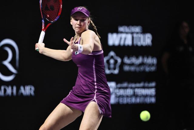 Kazakhstan's Elena Rybakina hits a return to Belarus' Aryna Sabalenka during the final of the Women's WTA Finals, in Riyadh on November 8, 2025. (Photo by Fayez NURELDINE / AFP)