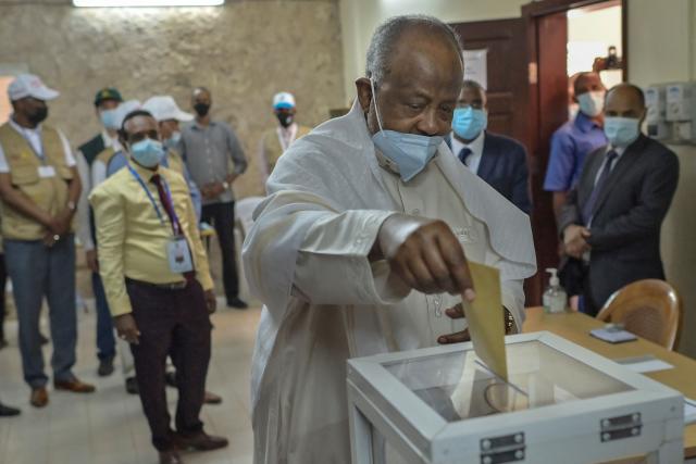 (FILES) Djibouti's incumbent president Ismail Omar Guelleh (C) casts his ballot at the Ras-Dika district polling station in the capital Djibouti on April 9, 2021. Djibouti's President Ismail Omar Guelleh, in power since 1999, confirmed Saturday that he would run for a sixth term in elections next year, after parliament removed a constitutional barrier that had prevented him from running again.
The 77-year-old accepted the nomination from his People's Rally for Progress (RPP) party during a congress in the capital, a statement from the presidency said.
The Horn of Africa nation is a stable state in an often troubled region, operating a major port that hosts military bases for the United States, France, China, Japan and Italy. (Photo by TONY KARUMBA / AFP)