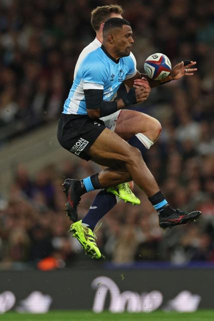 Fiji's wing Jiuta Wainiqolo wins a high ball during the Autumn Nations Series international rugby union match between England and Fiji at Allianz Stadium, Twickenham, in south-west London, on November 8, 2025. (Photo by Adrian Dennis / AFP)