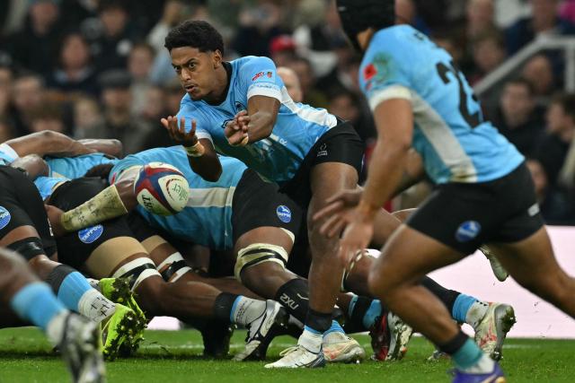 Fiji's Sam Wye passes the ball during the Autumn Nations Series international rugby union match between England and Fiji at Allianz Stadium, Twickenham, in south-west London, on November 8, 2025. (Photo by Glyn KIRK / AFP)