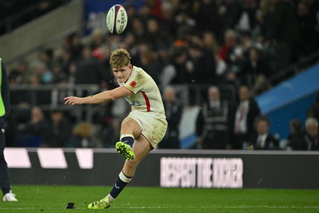 England's fly-half Fin Smith kicks a conversion during the Autumn Nations Series international rugby union match between England and Fiji at Allianz Stadium, Twickenham, in south-west London, on November 8, 2025. (Photo by Glyn KIRK / AFP)