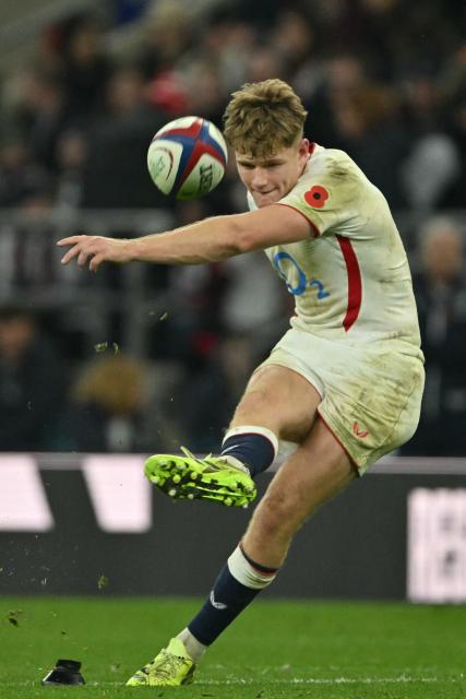 England's fly-half Fin Smith kicks a conversion during the Autumn Nations Series international rugby union match between England and Fiji at Allianz Stadium, Twickenham, in south-west London, on November 8, 2025. (Photo by Glyn KIRK / AFP)
