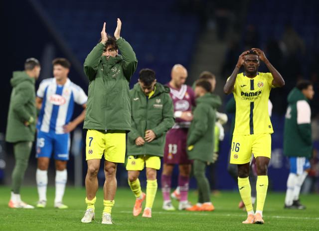 Villarreal's Spanish forward #07 Gerard and Villarreal's Ghanaian midfielder #16 Thomas Partey celebrate victory at the end the Spanish league football match between RCD Espanyol and Villarreal CF at RCDE Stadium in Cornella de Llobregat on November 8, 2025. Villarreal won 0-2. (Photo by Josep LAGO / AFP)