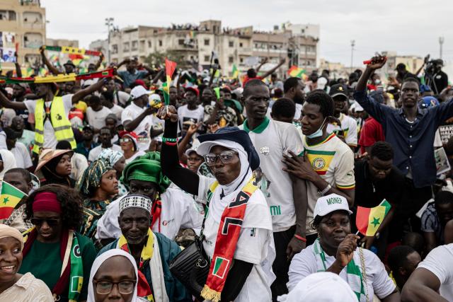TOPSHOT - A supporter of Senegal’s Prime Minister Ousmane Sonko dances during a rally in Dakar, on November 8, 2025. (Photo by PATRICK MEINHARDT / AFP)