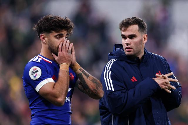France's fly-half #10 Romain Ntamack (L) and France's wing #14 Damian Penaud discuss at the end of the Autumn Nations Series international rugby union test match between France and South Africa at the Stade de France in Saint-Denis, Paris' suburb, on November 8, 2025. (Photo by FRANCK FIFE / AFP)
