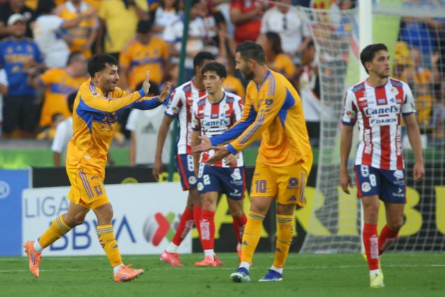 Tigres' Argentine forward #07 Angel Correa (L) celebrates with teammate French forward #10 Andre-Pierre Gignac scoring his team's first goal during the Liga MX Apertura tournament football match between Tigres and San Luis at the UANL University Stadium in San Nicolas de los Garza, Nuevo Leon State, Mexico on November 8, 2025. (Photo by Julio Cesar AGUILAR / AFP)