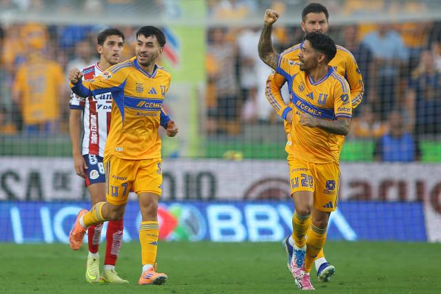 Tigres' Argentine forward #07 Angel Correa (L) celebrates next to teammate defender #20 Javier Aquino scoring his team's first goal during the Liga MX Apertura tournament football match between Tigres and San Luis at the UANL University Stadium in San Nicolas de los Garza, Nuevo Leon State, Mexico on November 8, 2025. (Photo by Julio Cesar AGUILAR / AFP)