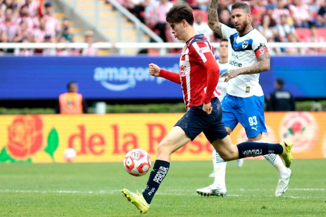Guadalajara's forward #34 Armando Gonzalez controls the ball past Monterrey's Spanish defender #93 Sergio Ramos during the Liga MX Apertura football match between Guadalajara and Monterrey at the Akron Stadium in Zapopan, Mexico on November 8, 2025. (Photo by Ulises Ruiz / AFP)