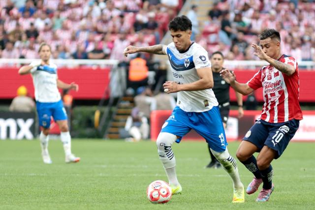 Monterrey's defender #13 Carlos Salcedo and Guadalajara's forward #10 Efrain Alvarez fight for the ball during the Liga MX Apertura football match between Guadalajara and Monterrey at the Akron Stadium in Zapopan, Mexico on November 8, 2025. (Photo by Ulises Ruiz / AFP)