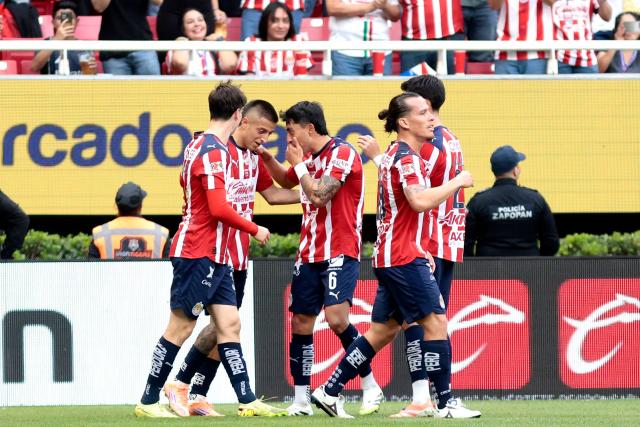 Guadalajara's forward #25 Roberto Alvarado (2nd L) celebrates with teammates after scoring during the Liga MX Apertura football match between Guadalajara and Monterrey at the Akron Stadium in Zapopan, Mexico on November 8, 2025. (Photo by Ulises Ruiz / AFP)