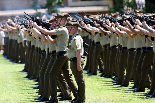 A gun salute is sfired at the Centenary Parade at Victoria Barracks in Sydney on November 9, 2025 during the visit of Britain's Princess Anne, Princess Royal. Princess Anne is visiting Australia to mark the Centenary of the Royal Australian Corps of Signals. (Photo by Damian Shaw / POOL / AFP)
