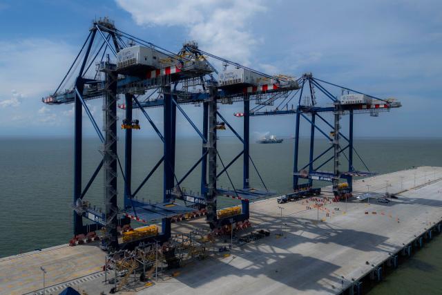 This aerial view shows the port installations of Puerto Antioquia in the Gulf of Uraba, Antioquia department, Colombia on November 8, 2025. France's Foreign Affairs Minister Jean-Noel Barrot travelled to the troubled Gulf of Uraba to visit a huge port under construction, which is one of the largest French private investment projects in Colombia, according to the diplomatic delegation. (Photo by Luis ACOSTA / AFP)