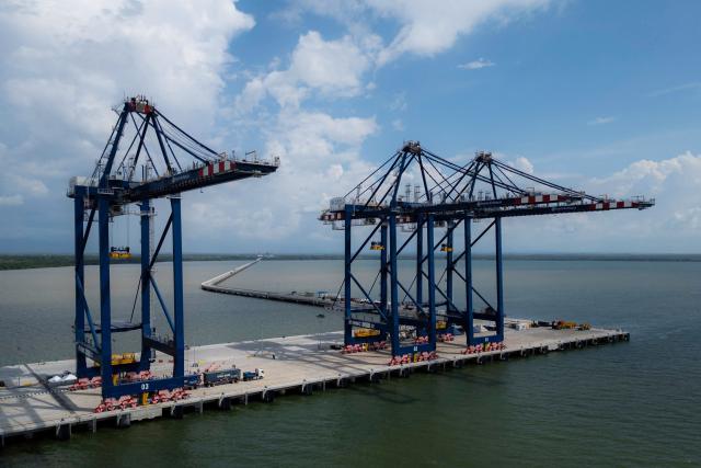 This aerial view shows the port installations of Puerto Antioquia in the Gulf of Uraba, Antioquia department, Colombia on November 8, 2025. France's Foreign Affairs Minister Jean-Noel Barrot travelled to the troubled Gulf of Uraba to visit a huge port under construction, which is one of the largest French private investment projects in Colombia, according to the diplomatic delegation. (Photo by Luis ACOSTA / AFP)