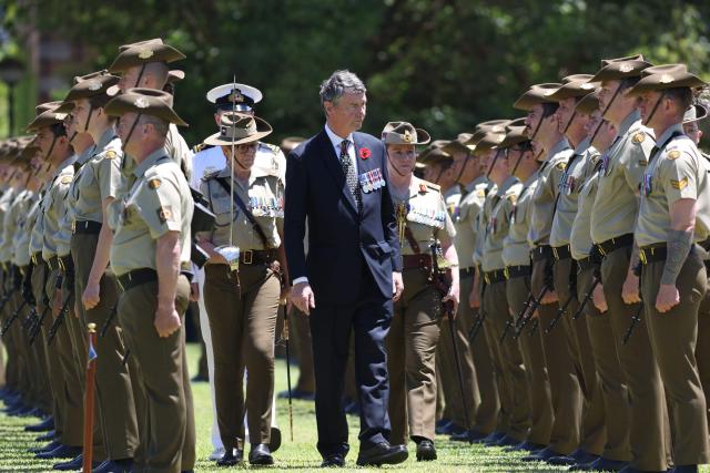 Vice Admiral Sir Tim Laurence inspects the Centenary Parade at Victoria Barracks in Sydney on November 9, 2025, during the visit of Britain's Princess Anne, Princess Royal. Princess Anne is visiting Australia to mark the Centenary of the Royal Australian Corps of Signals. (Photo by Damian Shaw / POOL / AFP)